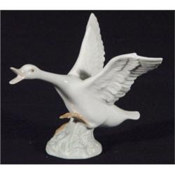 Hand painted Lladro flying goose, marks to base, 14cm high