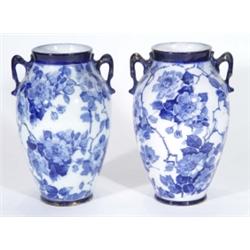 Pair of Phoenixware vases, transfer printed with blue and white flowers, marks to bases, 23cm high