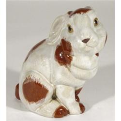 Brown and white glazed seated staffordshire pottery rabbit, 21cm high
