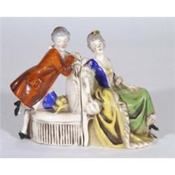 Pair of hand painted Goebels bookends modelled as an Edwardian gentleman and lady, printed marks to