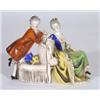 Pair of hand painted Goebels bookends modelled as an Edwardian gentleman and lady, printed marks to