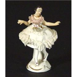 Hand painted German porcelain ballerina in a lacework dress, marks to base, 10cm high