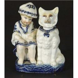 German porcelain figure group of a young boy beside a nodding dog, 13cm high