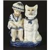 German porcelain figure group of a young boy beside a nodding dog, 13cm high