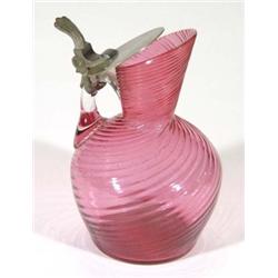 Cranberry coloured spiral glass ewer with metal mounts, 12cm high