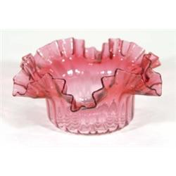 Cranberry glass bowl with fluted and frilled edge, 16cm diameter