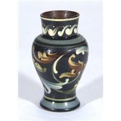 Exeter pottery vase, hand painted with stylised leaves onto a blue ground, impressed marks to base,