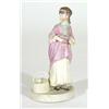 Hand painted Victorian bisque figurine of a woman in a dress beside a basket, 20cm high