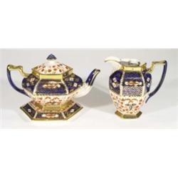 Victorian pottery teapot on stand and hot water pot, hand painted and gilded with Imari style patter