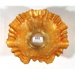 Fluted orange carnival glass bowl, relief moulded with panels of peacocks and leaves and berries, 22