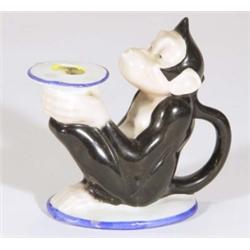Comical hand painted porcelain monkey chamberstick, 13cm high
