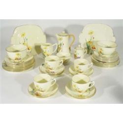 Quantity of Crown Staffordshire Art Deco teaware, hand painted with flowers including milk jugs, sug