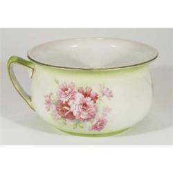 Edwardian chamberpot, transfer printed with flowers onto a green ground, marks to base, 15cm high