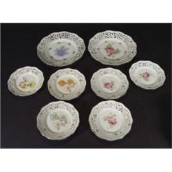 Twelve place Continental porcelain pierced dessert service, comprising two large cake plates and ten