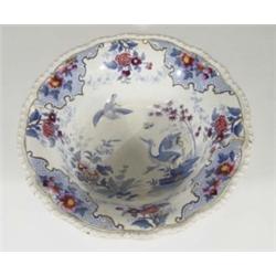 Victorian stone china wash bowl, hand coloured and transfer printed with birds and storks amongst fl