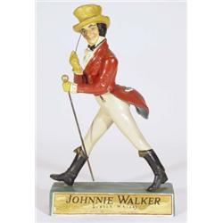 Painted pine Johnny Walker advertising figure on a rectangular base, 41cm high