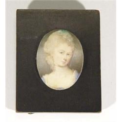 Ebonised framed oval portrait miniature of a young woman onto ivory, 4cm high