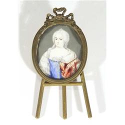 Brass framed miniature of a woman in a jewelled dress onto ivory, 9cm high