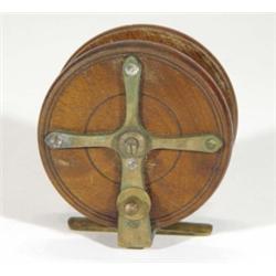 Turned mahogany and brass fishing reel, 10cm diameter