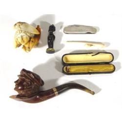 Group of assorted smoking memorabilia including a Victorian meerschaum pipe carved with a female hea