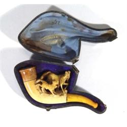 Leather cased meerschaum pipe carved with a dog chasing a horse, printed 'Chamorel & Wthwer, Lausann
