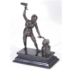 Bronze figure of Turkish style blacksmith on a hardwood base, 22cm high
