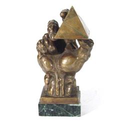 Bronze figure of a hand clutching an obelisk on a marble base, 26cm high