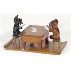 Oak cigarette box, modelled as two dogs with glass eyes playing cards at a table, 25cm in length