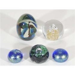 Two blue iridescent glass paperweights, a Guernsey Studio weight and two others, largest 11cm high