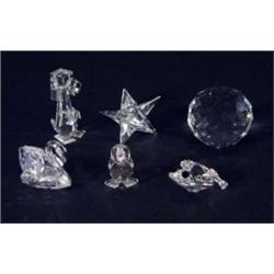 Swarovski crystal paperweight, a star and four animals, marks to bases