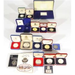 Selection of commemorative coins and plaques including a silver Tower of London plaque, silver comme