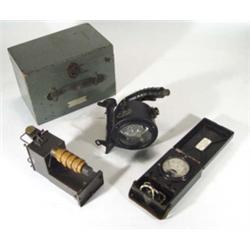 Wooden cased admiralty military signal lamp and a volt testing kit