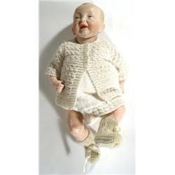 Hand painted Kaiser bisque headed doll with composite arms and legs, impressed marks and numbered 36