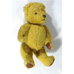British jointed teddy bear with squeaker, 28cm high