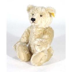 Steiff jointed teddy bear with squeaker and label to ear, 34cm high