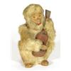 Clockwork animated fur covered monkey guitar player, 28cm high