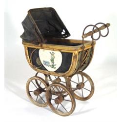 Edwardian cane framed doll's pram on an iron base