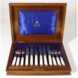 Set of six Victorian mahogany and burr walnut cased mother of pearl handled silver fruit knives and