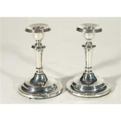 Pair of circular based silver candlesticks, Birmingham, 1907, 13cm high
