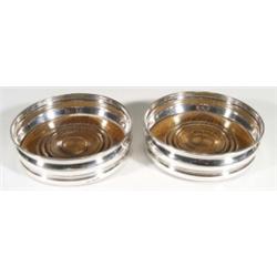 Pair of silver and oak based wine coasters, 15cm diameter