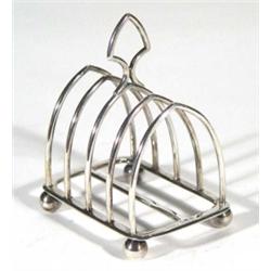 Four slice silver Hukin & Heath toast rack, 8cm in length