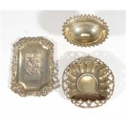 Rectangular silver dish chased with a scene of lovers, an oval salt and a fluted dish, various dates