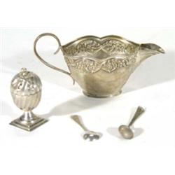 Floral embossed silver cream jug, square based silver pepperette and two spoons
