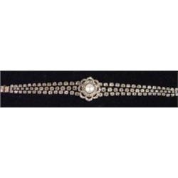 Gold three string diamond bracelet with flowerhead and pearl centre set with approximately 10ct of d