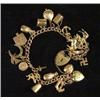 Image 1 : 9ct gold charm bracelet set with approximately 20 assorted gold charms