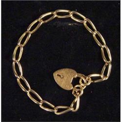 Gold bracelet with heart shaped clasp