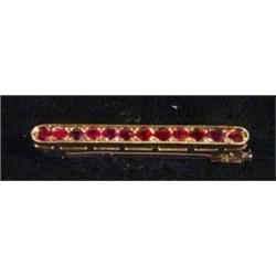 Gold ruby set bar brooch