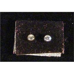 Pair of small diamond stud earrings, approximately 1/8th ct