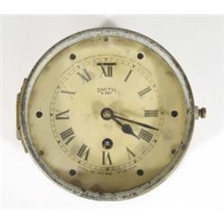 Smiths 1943 brass cased bulkhead naval clock with eight day movement, 16cm diameter