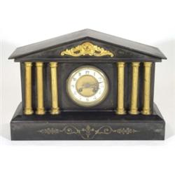 Victorian black slate mantelclock supported by six gilded columns with enamel dial, 30cm high